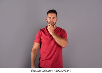 A Worried Young Man In A Red Tshirt