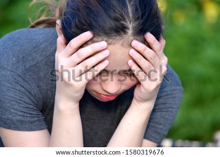 Similar – a desperate woman holding her hands in front of her face