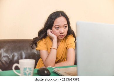 A Worried Young Woman In Deep Thoughts. Concerned About Her Final Grades In Her Examinations Or Performance In School.