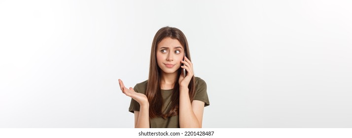 Worried young woman looks nervously, Female is nervous while talking on the phone, feels frustrated and worrying phone talk concept - Shutterstock ID 2201428487