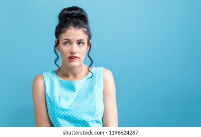 Worried Young Woman On A Solid Background