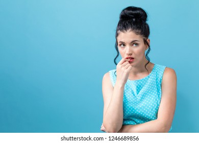 Worried Young Woman On A Solid Background