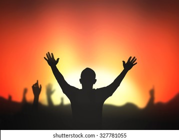 Worship God concept: Silhouettes people hand raised against red autumn sunset sky background
