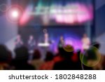 Worship God on Sunday with joy. /Picture blur effect./Concert in low light and lens flare.