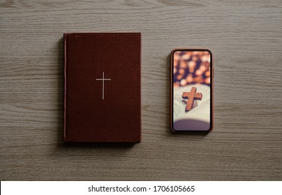 Worship From Home, Online Live Church For Sunday Service, Top View Of Mobile Screen With Cross And Bible With Wooden Cross