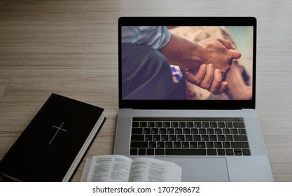 Worship From Home, Online Live Church For Sunday Service, Laptop Screen With Close Up Prayer Hands, Bible On Wooden Table, Quarantine For Covid 19 Situation