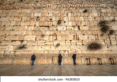 Worshipers at the Western  Wall in Jerusalem, Israel. The wall is one of the holiest sites in Judaism except for the Temple Mount itself.