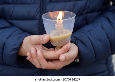 Worshipper Participating In A Candlelit Vigil. Fatima. Portugal.  06-20-2021