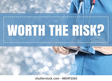 Worth The Risk Text On Medical Doctor Blur Lights Background.