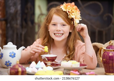 Would You Like Some Tea. A Cute Red Headed Girl Playing Dress Up And Having A Tea Party.