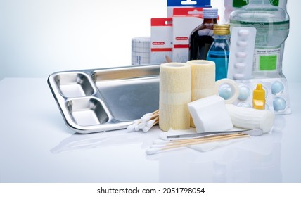 Wound care dressing set. Wound care equipment in hospital for nurse. Conform bandage, forceps, alcohol, cotton sticks, povidone-iodine for infection wound. Medical supply. Medical equipment for nurse.