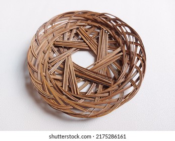 Woven Bamboo Plate.  Usually Used As A Base And Covered Again With Banana Leaves Or Paper.  Isolated Background In White