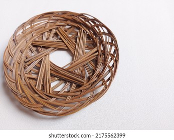 Woven Bamboo Plate.  Usually Used As A Base And Covered Again With Banana Leaves Or Paper.  Isolated Background In White