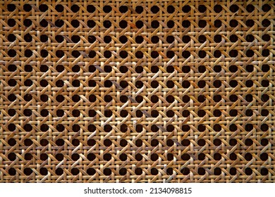 Woven bamboo strips close-up patterned bamboo rattan texture background.