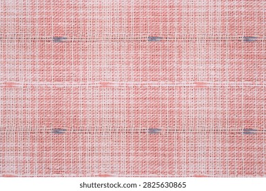 Woven fabric with a grid pattern and dark blue accents.