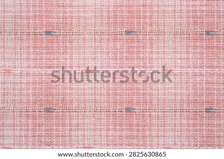Woven fabric with a grid pattern and dark blue accents.
