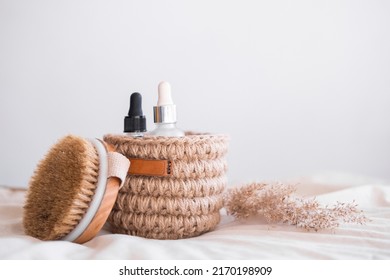 Woven Jute Basket With Natural Body Care Products With Body Brush In Bathroom Near Mirror. Beige Interior Natural Hygiene Products. Zero Waste Concept.