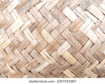 woven texture background of bamboo trees. up close the texture of traditional handicrafts or woven art, looks beautiful with patterns, stripes and criss-crosses. nice background. natural concept.