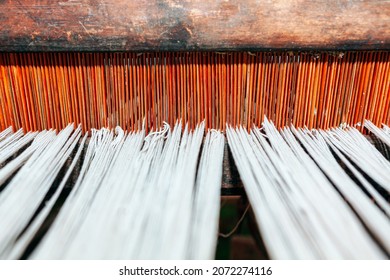 Woven Threads Background . Tapestry Loom With Wooden Base . Ancient Loom With White Threads