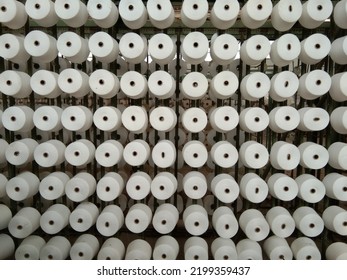 Woven Threads Neatly Arranged In A Textile Factory Warehouse