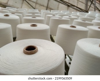 Woven Threads Neatly Arranged In A Textile Factory Warehouse