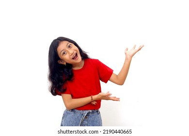 Wow and amazed expression of asian little girl while presenting something on empty space - Shutterstock ID 2190440665
