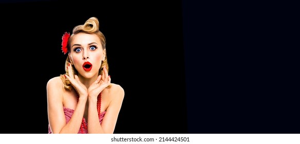 wow. awe. Unbelievable news! Excited surprised, very happy blond hair woman. Pinup syle girl with open mouth and raised hands. Retro and vintage studio concept. Dark black background.