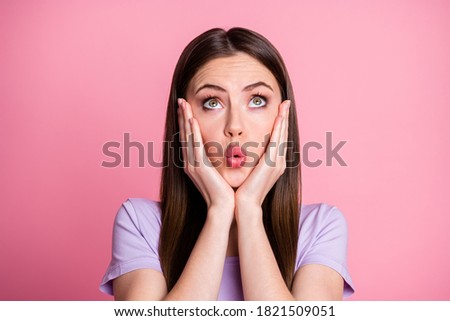 WOW. Closeup photo of attractive adorable lady hands on cheekbones cute appearance look up empty space interested wear casual violet t-shirt isolated pink pastel color background