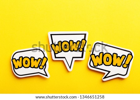 WOW concept speech bubble isolated on yellow background.