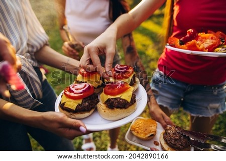 Similar – Mann hält Hot Dog im Barbecue mit Freunden.