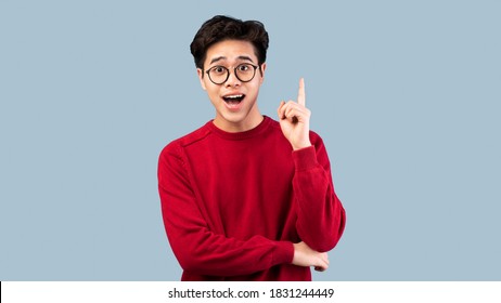 Wow, Eureka. Portrait of emotional asian student having great idea, finding inspiration or solution to problem. Excited amazed guy in glasses with open mouth pointing finger up over studio background - Powered by Shutterstock