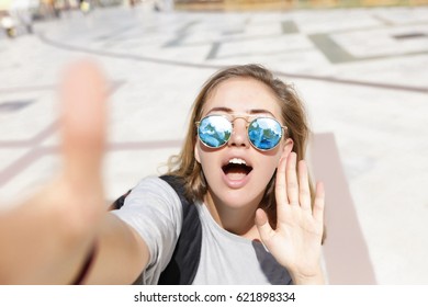 Wow Face Woman,talking To Camera,laugh Woman,bag,say Hello,feathers In Their Hair, Bracelets, Flash Tattoo, Indie, Bohemia, Boho Style,round Sunglasses,tourist Background.