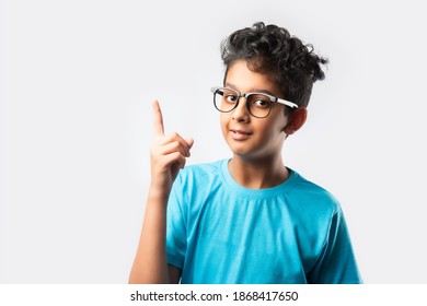 Wow Look, Portrait Of Amazed Cute Little Indian Asian Boy With Spectacles Pointing To Empty Place On Background, Surprised Preschooler Showing Copy Space