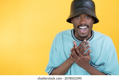 Wow Reaction. Happy Man. Rapper Lifestyle. Positive Guy In Stylish Leather Hat Expressing Surprise And Joy Isolated Yellow Copy Space.