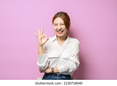 Wow Really Not Bad, Good Choice. Impressed Modern 20s Woman In Shirt, Not Accepting, Winking Show Okay, Approval Sign, Stand Pink Background.