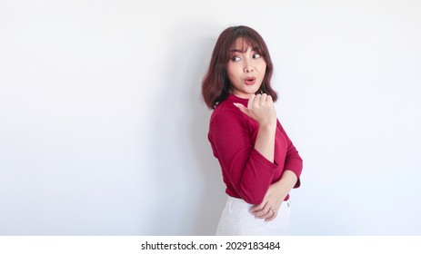 Wow And Shock Asian Beautiful Girl Point Behind Her In White Background