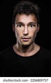 WOW - shocked man with surprised eyes look at camera eyes wide open and pupils big and wide - Shutterstock ID 2206809757