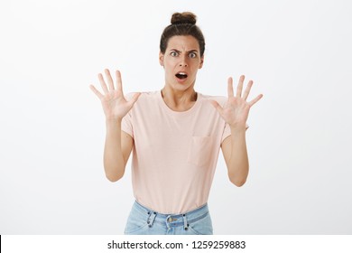 Wow Slow Down Dude. Shocked Stunned And Digusted Young Attractive Female Reacting To Shocking Creepy Suggestion Raising Palms In Stop Or Hold On Gesture Frowning Open Mouth In Aversion And Dislike