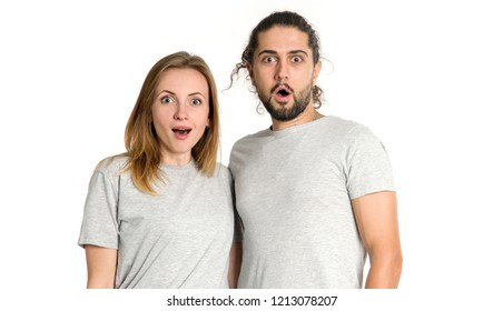 Wow! Surprised face. Portrait of couple man and woman looking at camera on white background. - Shutterstock ID 1213078207