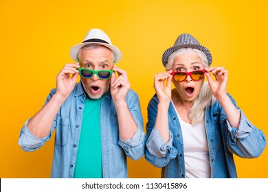 Wow unbelievable! Success win winner victory facial expressing hipster concept. Close up photo portrait of two excited astonished scared beautiful handsome people touching glasses isolated background
