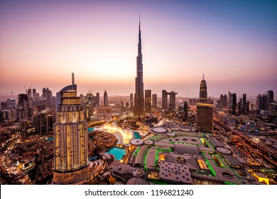 WOW view of Dubai skyline at night. City lights popping. Dancing fountain display. Luxury travel holiday concept.   - Shutterstock ID 1196821240