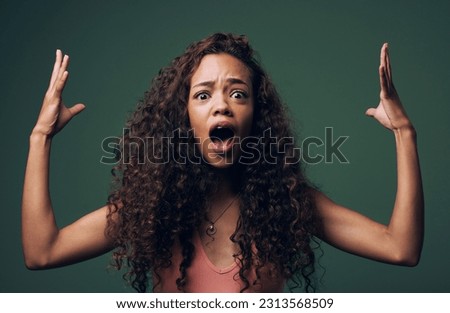 Wow, wtf and portrait of woman mind blown in studio by news, gossip or drama on green background. Omg, face and female model shocked, surprise and confused with open mouth emoji, hands or expression