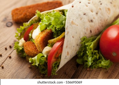 Wrap with chicken on a wood table