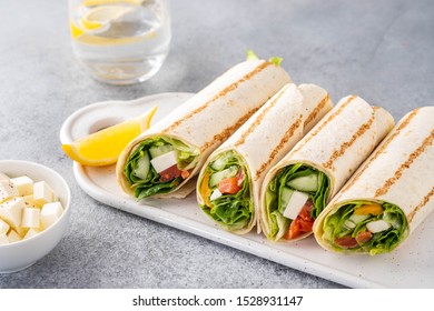 Wrap Sandwich, Roll With Fish Salmon, Vegetables And Cheese. Grey Background. Close Up.