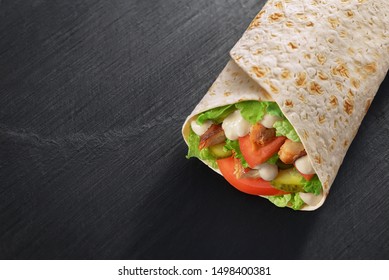 Wrap Sandwich With Salad, Chicken, Sauce, Nappa Cabbage, Tomato, Pickles On Dark Black Slate Texture. Copyspace