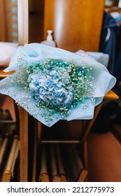 Wrapped Bouquet With Blue Hydrangea And Wildflowers Close-up.