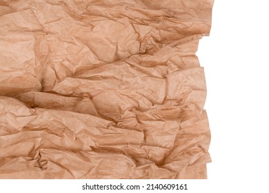 Wrapped Kraft Paper Or Baking Parchment Isolated On White Background With Copy Space. Sustainable Packaging Concept, Wrapped Paper As Background. Selective Focus