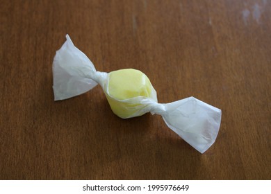 A Wrapped Piece Of Lemon Saltwater Taffy