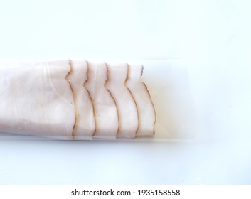 Wrapped Turkey Deli Meat On White With Copy Space