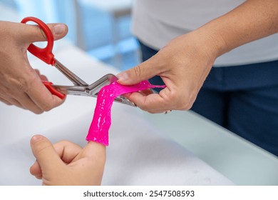 Wrapping elastic band around fingers, protecting hand. - Powered by Shutterstock